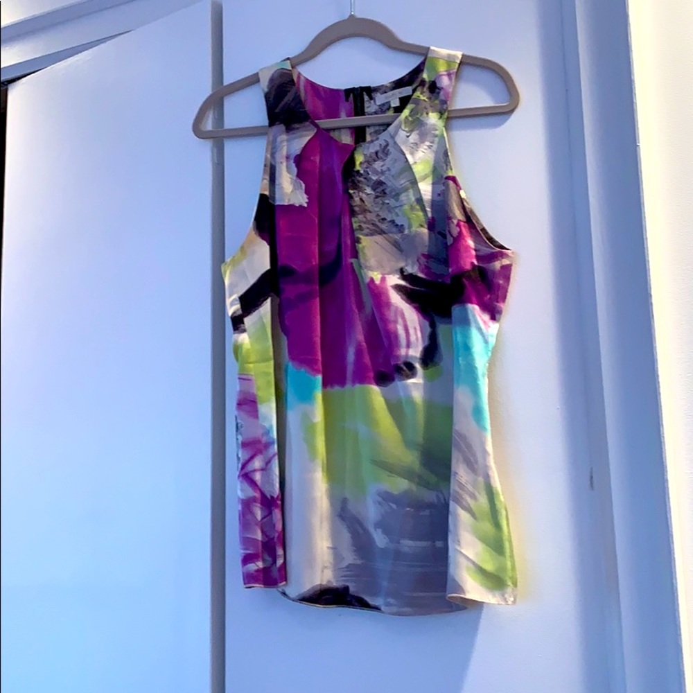 100% silk top. Back zipper. L